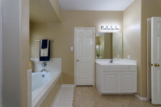 3905 Austin Lake Ct, Pearland, TX 77581 - full bath featuring tile patterned flooring, baseboards, a garden tub, and vanity