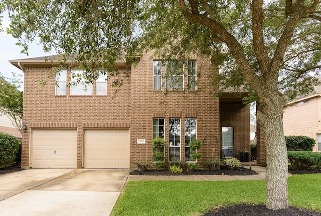 3905 Austin Lake Ct, Pearland, TX 77581 - traditional-style house with concrete driveway, brick siding, a front yard, and a garage