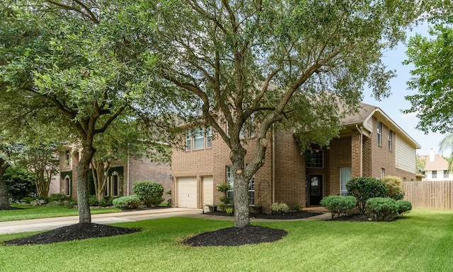 3905 Austin Lake Ct, Pearland, TX 77581 - view of front of property featuring driveway, a front yard, brick siding, fence, and an attached garage
