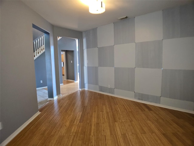 3905 Austin Lake Ct, Pearland, TX 77581 - empty room with visible vents, baseboards, and wood finished floors