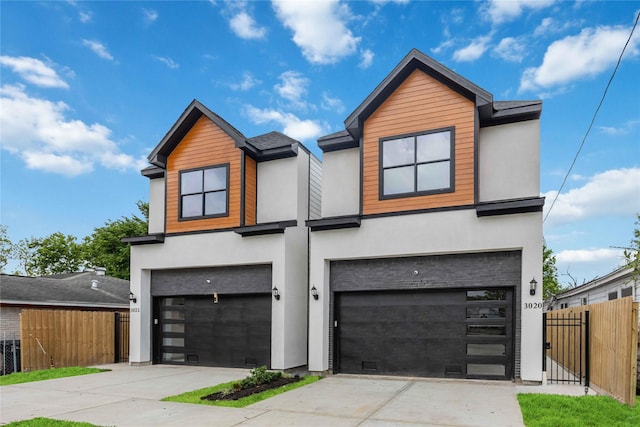 3020 Retta St, Houston, TX 77026 - view of front of home featuring fence, stucco siding, and an attached garage