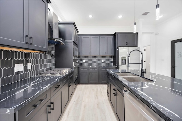 3020 Retta St, Houston, TX 77026 - kitchen featuring backsplash, decorative light fixtures, crown molding, a sink, and dark stone counters