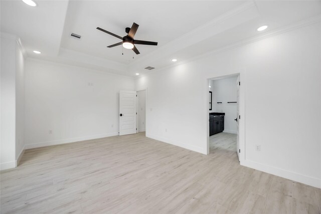 3020 Retta St, Houston, TX 77026 - empty room with light wood-style floors, ornamental molding, a tray ceiling, and ceiling fan