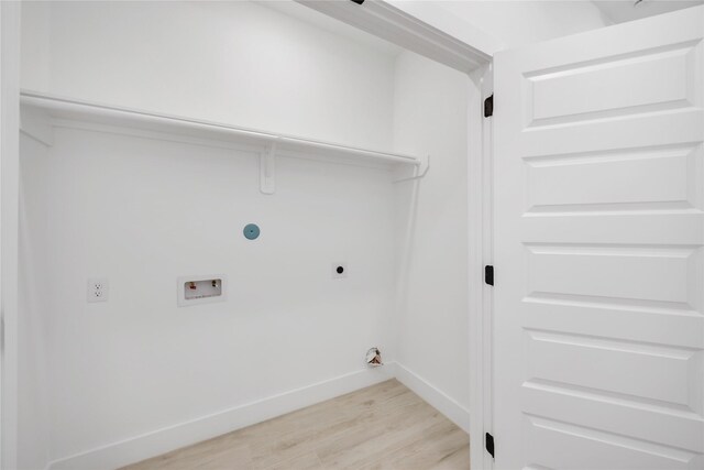 3020 Retta St, Houston, TX 77026 - washroom featuring washer hookup, hookup for an electric dryer, laundry area, baseboards, and light wood-style flooring