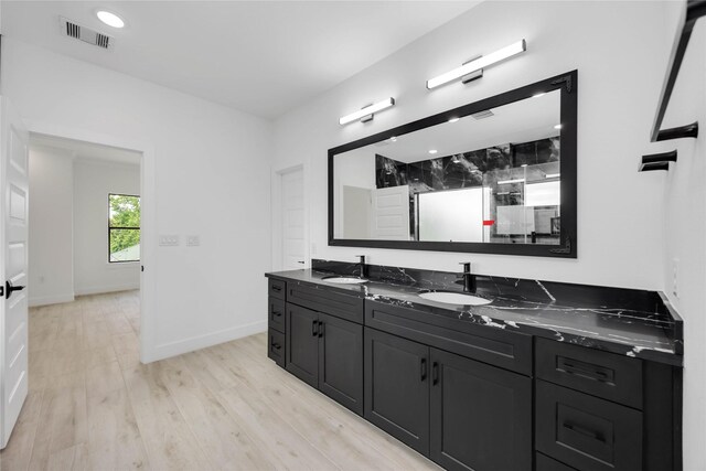 3020 Retta St, Houston, TX 77026 - bathroom featuring a sink, a stall shower, double vanity, and visible vents