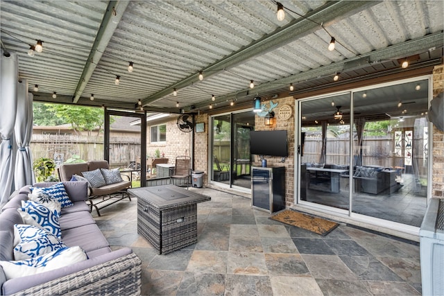 view of patio / terrace featuring an outdoor living space and fence
