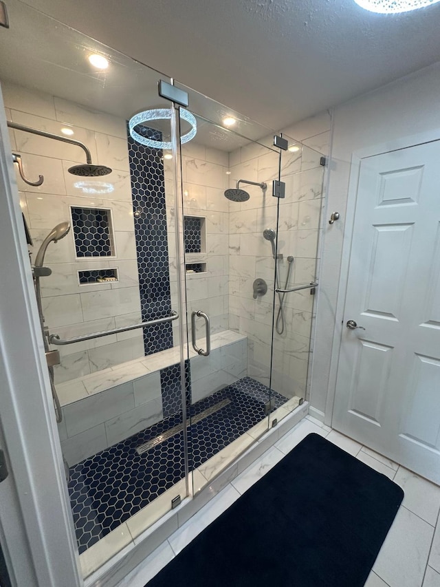 full bath with a stall shower, tile patterned floors, and recessed lighting