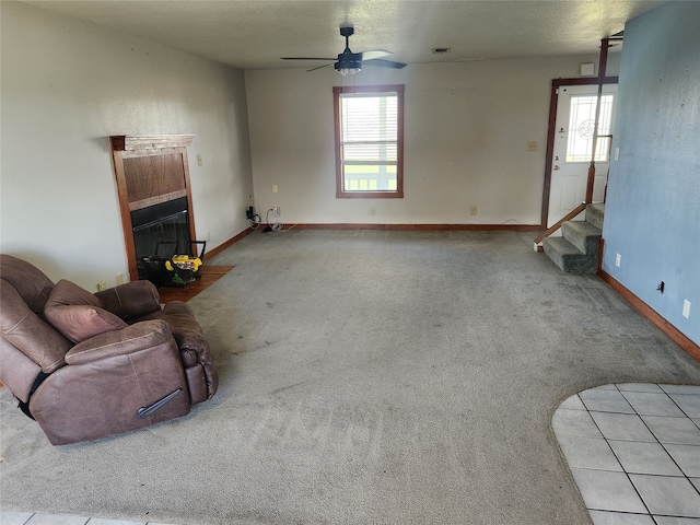 1783 River Valley Dr, Wharton, TX 77488 - unfurnished living room with healthy amount of natural light, a fireplace, and carpet flooring