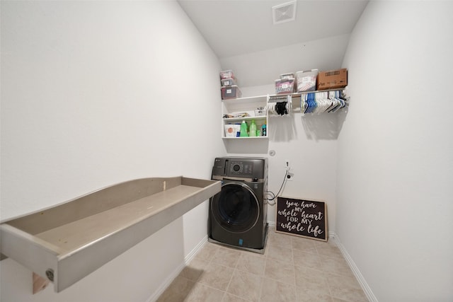 1202 Casal Springs Ct, Crosby, TX 77532 - washroom featuring laundry area, visible vents, light tile patterned floors, baseboards, and washer / dryer