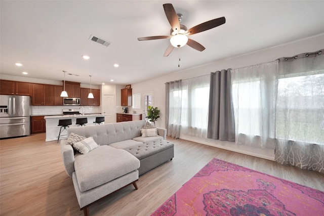 1202 Casal Springs Ct, Crosby, TX 77532 - living area featuring recessed lighting, ceiling fan, visible vents, and light wood-style flooring