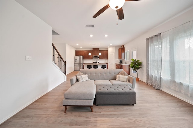 1202 Casal Springs Ct, Crosby, TX 77532 - living area with stairs, a ceiling fan, baseboards, recessed lighting, and visible vents