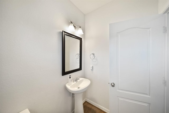 1202 Casal Springs Ct, Crosby, TX 77532 - bathroom featuring baseboards and wood finished floors
