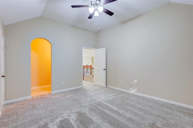5507 Opal Cove Ct, Katy, TX 77494 - unfurnished bedroom with baseboards, arched walkways, carpet, and lofted ceiling