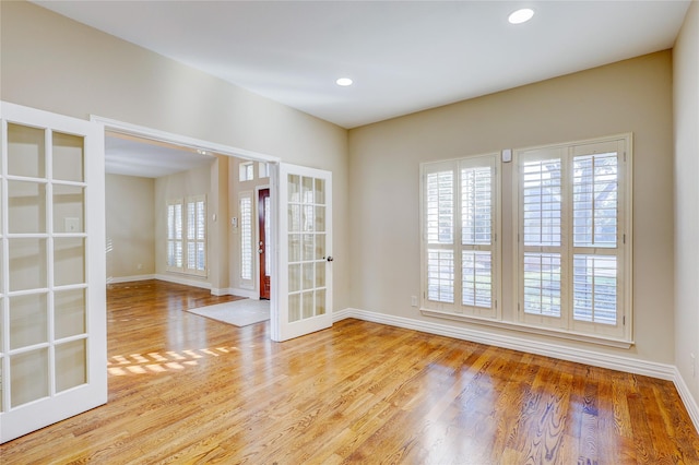 5507 Opal Cove Ct, Katy, TX 77494 - unfurnished room with french doors, recessed lighting, baseboards, and wood finished floors
