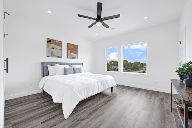 bedroom with wood finished floors, baseboards, recessed lighting, and ceiling fan