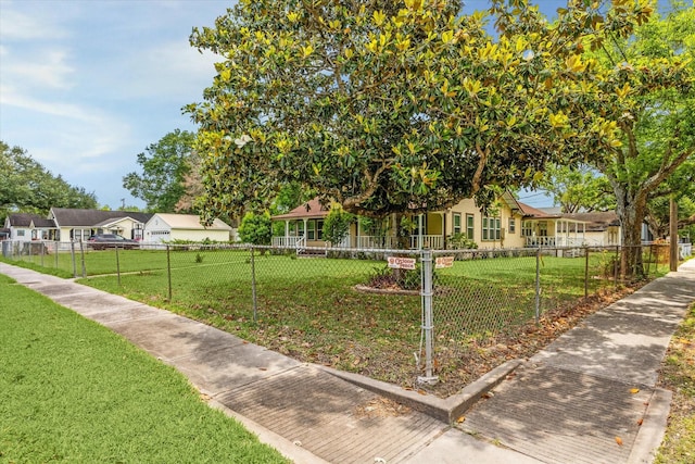 504 S Jackson St, Alvin, TX 77511 - view of home's community featuring a yard, a residential view, and a fenced front yard