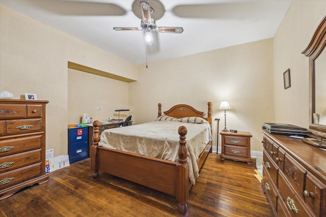 504 S Jackson St, Alvin, TX 77511 - bedroom featuring baseboards, ceiling fan, and dark wood-style floors