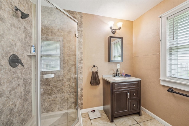 504 S Jackson St, Alvin, TX 77511 - bathroom with a stall shower, tile patterned flooring, a wealth of natural light, and baseboards