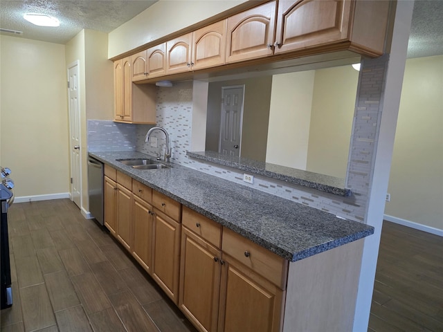 6444 Kentwick Dr Unit 24/13, Houston, TX 77084 - kitchen with a sink, decorative backsplash, stainless steel dishwasher, and a textured ceiling