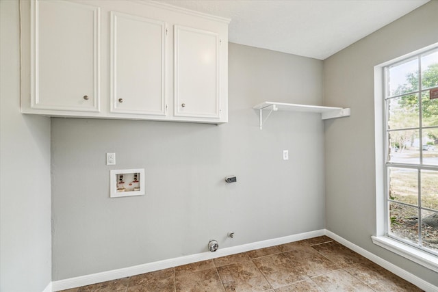washroom with baseboards, cabinet space, electric dryer hookup, and hookup for a washing machine