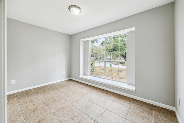 tiled spare room with baseboards