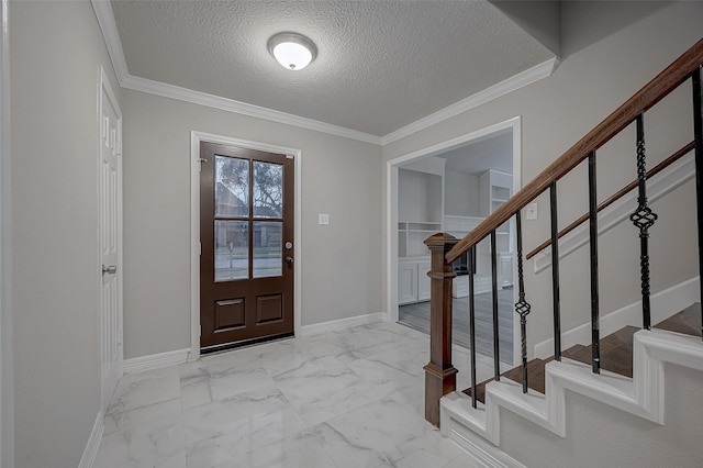foyer entrance with ornamental molding, marble finish floor, stairs, baseboards, and a textured ceiling