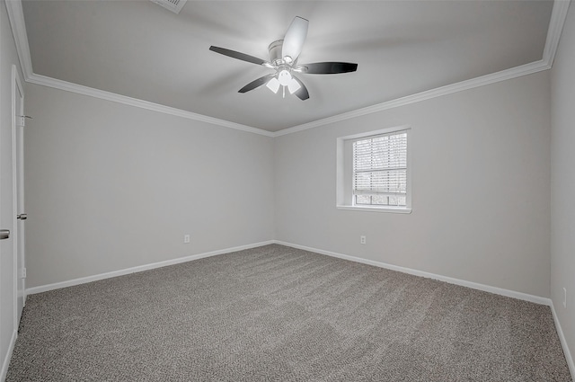 empty room featuring baseboards, ornamental molding, a ceiling fan, and carpet flooring