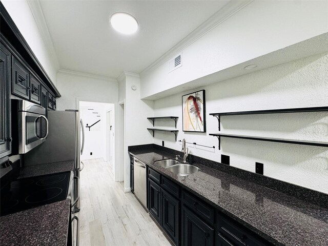 2323 Augusta Dr Unit 43, Houston, TX 77057 - kitchen featuring open shelves, appliances with stainless steel finishes, a sink, ornamental molding, and dark cabinets