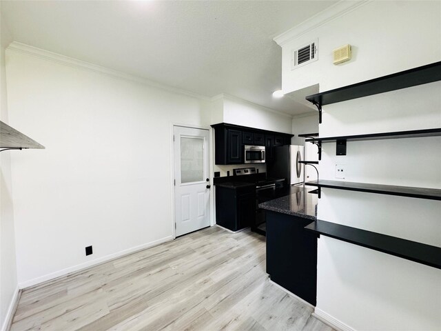 2323 Augusta Dr Unit 43, Houston, TX 77057 - kitchen featuring stainless steel microwave, dark cabinets, open shelves, ornamental molding, and light wood-type flooring