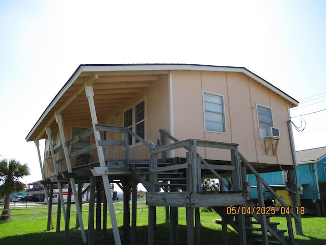 exterior space with a yard and cooling unit