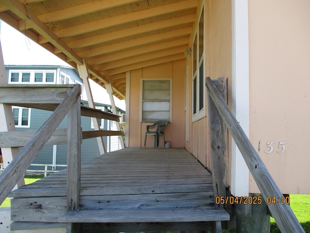 wooden terrace featuring stairway