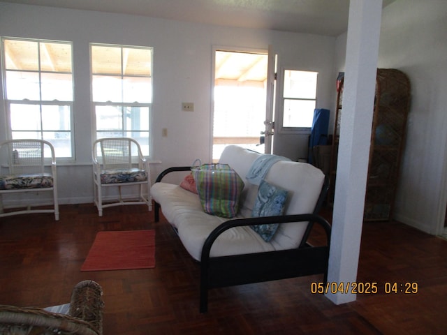 living room with baseboards and plenty of natural light