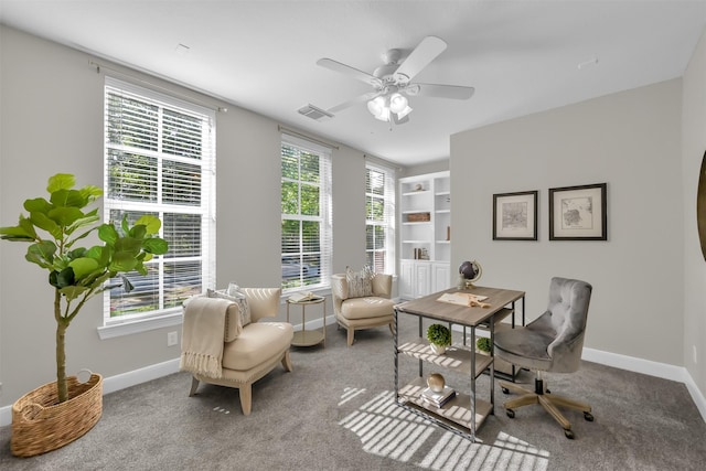 home office with baseboards, a ceiling fan, carpet flooring, and visible vents