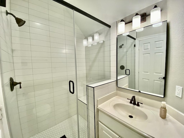 full bath with vanity and a stall shower