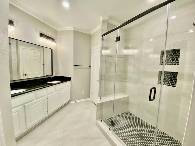 bathroom with crown molding, a sink, double vanity, baseboards, and a shower stall