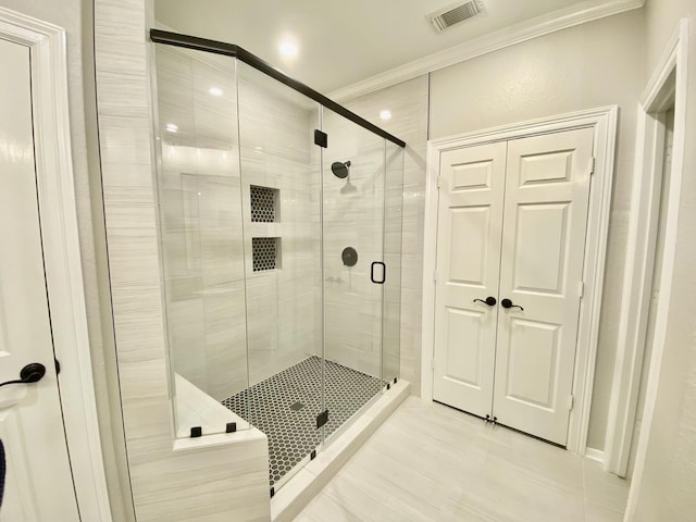 full bath with crown molding, recessed lighting, visible vents, and a shower stall