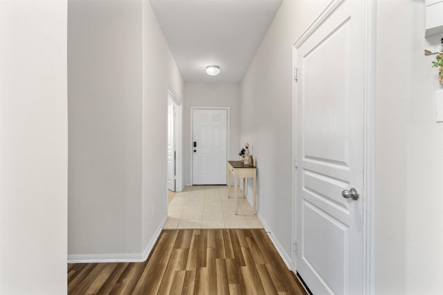 522 Pequin Rd, Crosby, TX 77532 - hallway with baseboards and wood finished floors