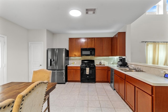 522 Pequin Rd, Crosby, TX 77532 - kitchen with a sink, light countertops, tasteful backsplash, visible vents, and black appliances