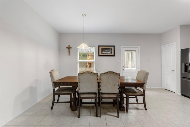 522 Pequin Rd, Crosby, TX 77532 - dining area with light tile patterned flooring, baseboards, and a healthy amount of sunlight