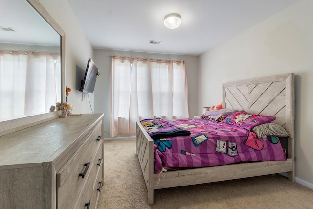 522 Pequin Rd, Crosby, TX 77532 - bedroom with multiple windows, visible vents, and light colored carpet