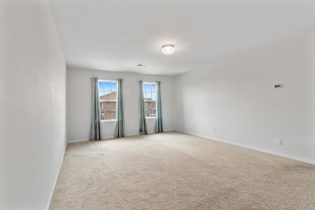 522 Pequin Rd, Crosby, TX 77532 - spare room featuring baseboards, light carpet, and visible vents