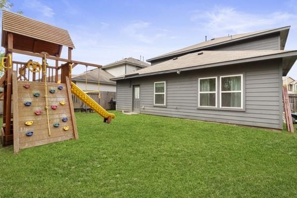 522 Pequin Rd, Crosby, TX 77532 - view of jungle gym with a yard and fence