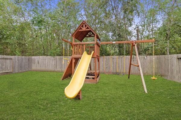 522 Pequin Rd, Crosby, TX 77532 - view of jungle gym featuring a fenced backyard and a yard