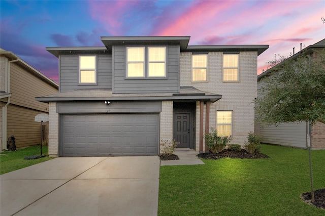 522 Pequin Rd, Crosby, TX 77532 - traditional-style house with a garage, driveway, a front lawn, and brick siding