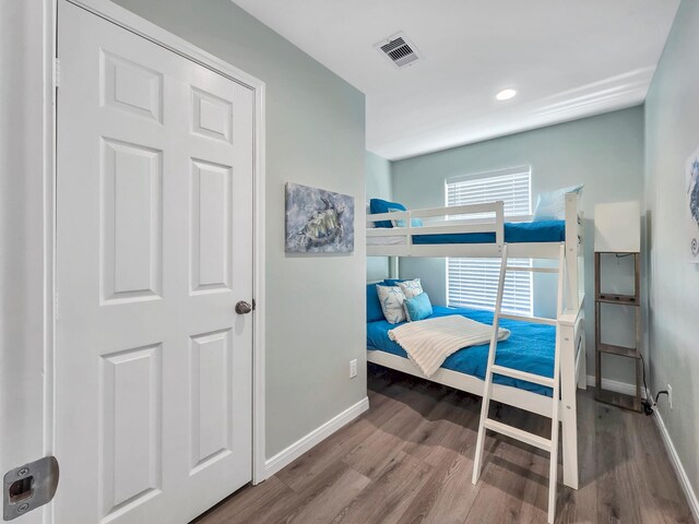 1062 Cedar Ln, Gilchrist, TX 77617 - bedroom featuring baseboards, wood finished floors, and recessed lighting