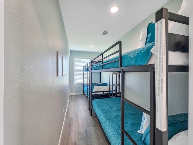 1062 Cedar Ln, Gilchrist, TX 77617 - bedroom with wood finished floors, baseboards, and recessed lighting