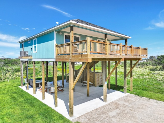 1062 Cedar Ln, Gilchrist, TX 77617 - view of patio / terrace with a wooden deck, a carport, and cooling unit