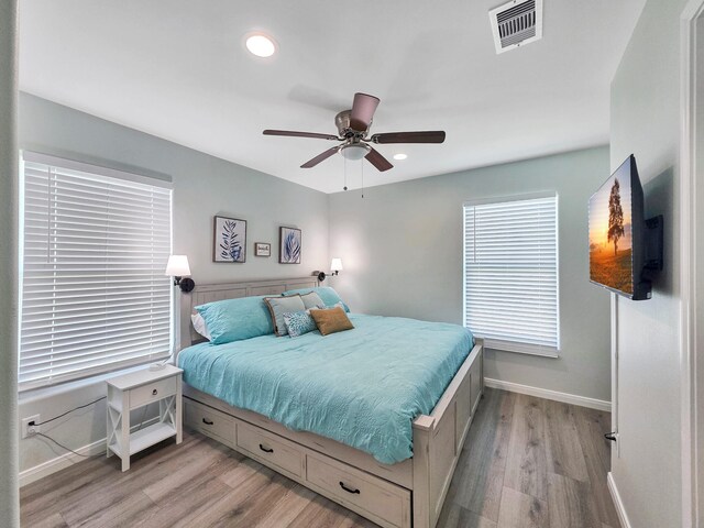 1062 Cedar Ln, Gilchrist, TX 77617 - bedroom featuring baseboards, light wood finished floors, recessed lighting, and ceiling fan
