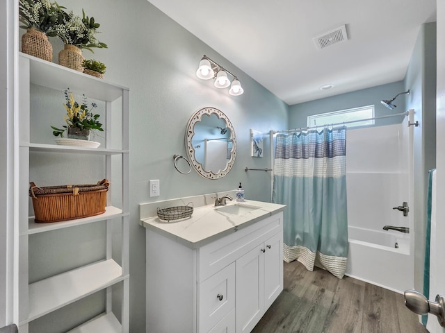 1062 Cedar Ln, Gilchrist, TX 77617 - bathroom featuring shower / bath combo, vanity, and wood finished floors