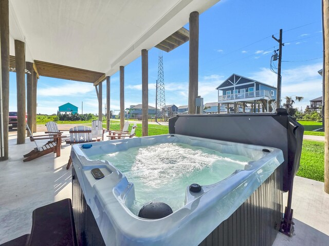 1062 Cedar Ln, Gilchrist, TX 77617 - view of patio with a hot tub